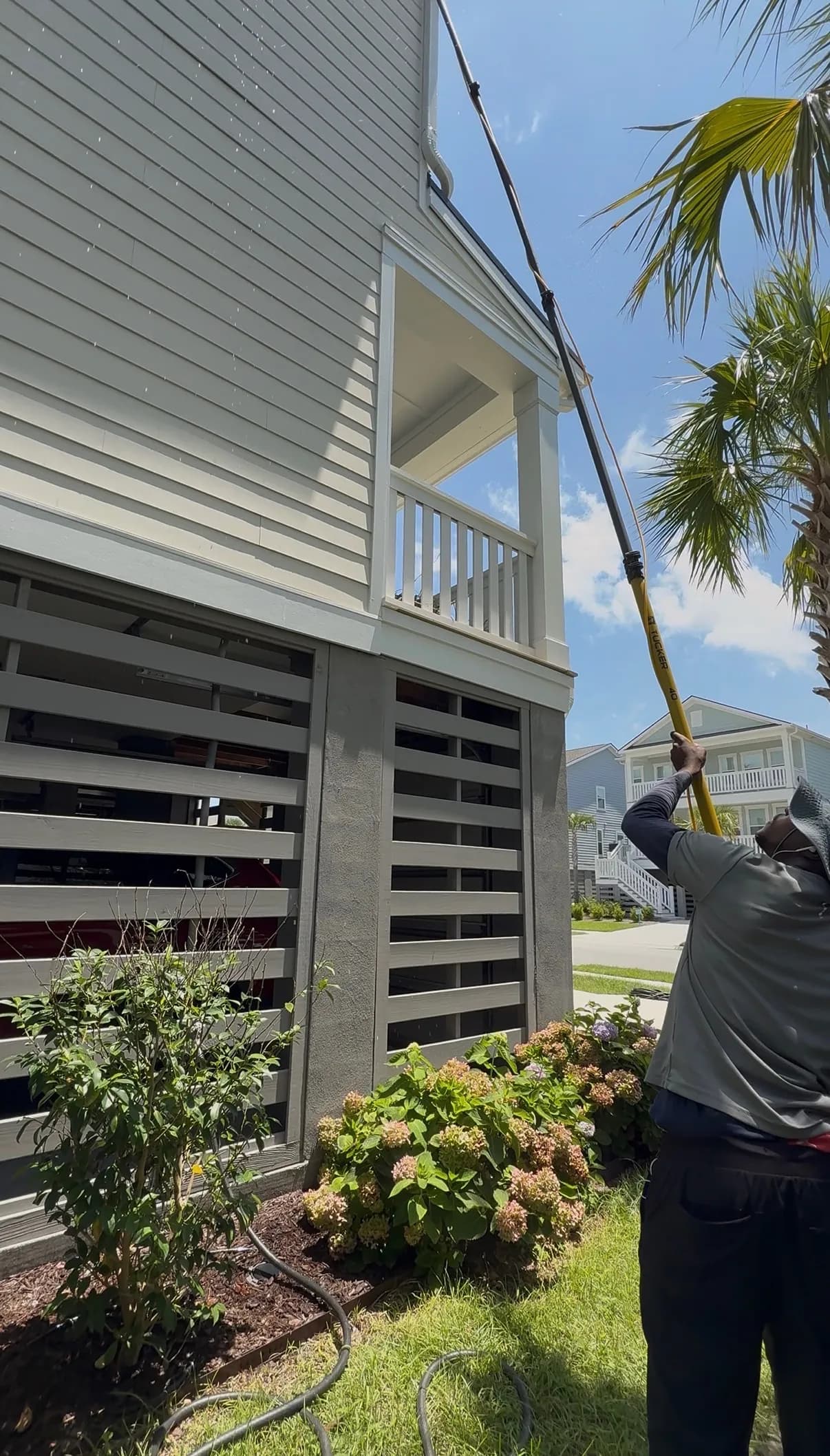 Professional window cleaning with water-fed pole in Charleston SC
